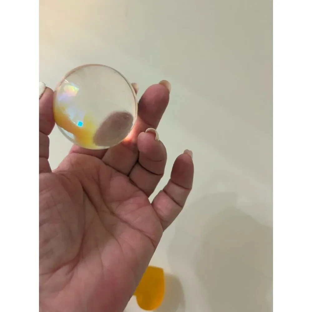 pottery bowl with clear crystal sphere and yellow cats eye heart gemstone